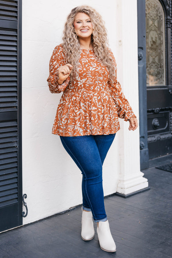 Chic Soul plus size clothing, rust colored long sleeve babydoll style top with leave pattern and slight ruffles at bottom of sleeve