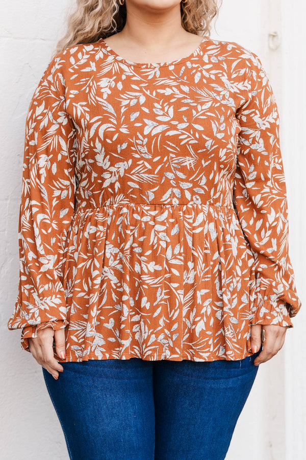 Chic Soul plus size clothing, rust colored long sleeve babydoll style top with leave pattern and slight ruffles at bottom of sleeve
