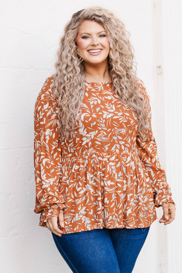 Chic Soul plus size clothing, rust colored long sleeve babydoll style top with leave pattern and slight ruffles at bottom of sleeve