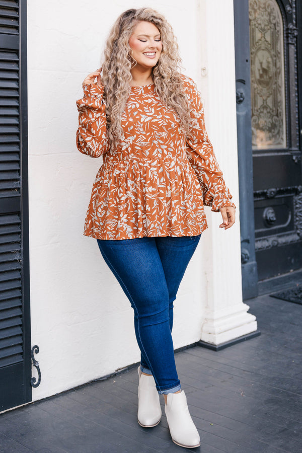 Chic Soul plus size clothing, rust colored long sleeve babydoll style top with leave pattern and slight ruffles at bottom of sleeve