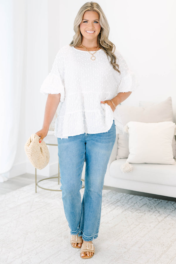 Plus size cream textured swiss dot top with flowy tiered silhouette and ruffle sleeves.