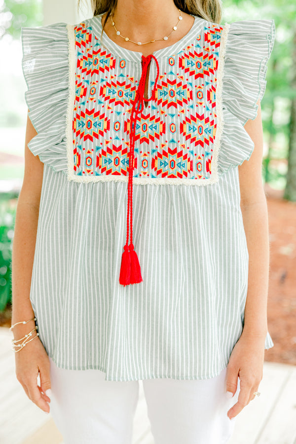 Chic Soul plus size clothing, light sage and white vertically striped flutter sleeve top with red tassel string tie at neckline and embroidered abstract red and blue pattern on upper front