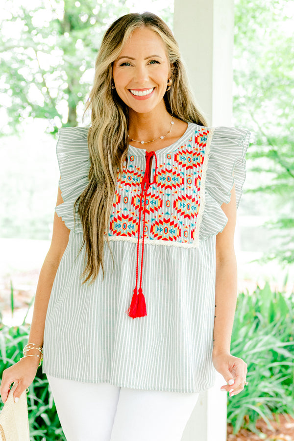 Chic Soul plus size clothing, light sage and white vertically striped flutter sleeve top with red tassel string tie at neckline and embroidered abstract red and blue pattern on upper front