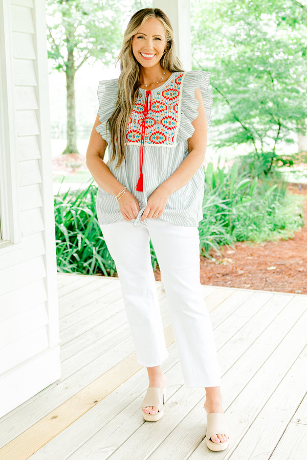 Chic Soul plus size clothing, light sage and white vertically striped flutter sleeve top with red tassel string tie at neckline and embroidered abstract red and blue pattern on upper front