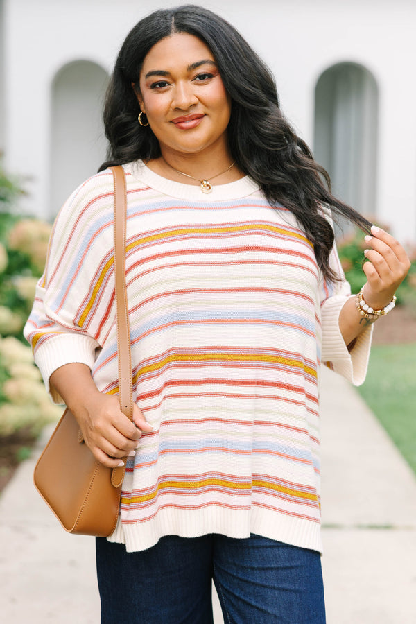 Plus size dusty rose striped sweater with a relaxed fit, drop shoulders, and short sleeves.