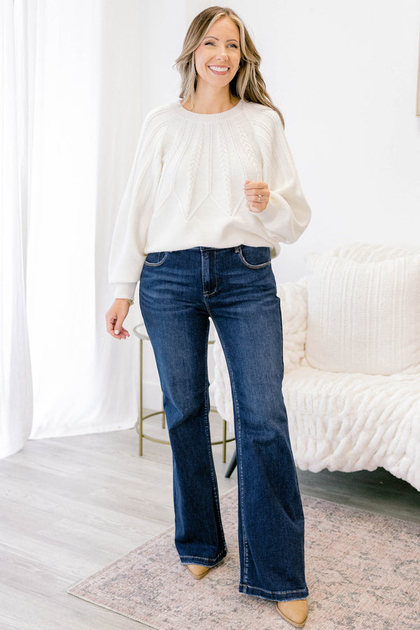 Chic Soul plus size clothing, dark wash bootcut jeans with a slightly distressed hem
