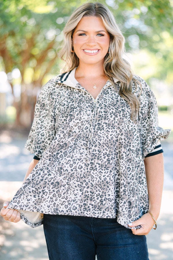 Plus Size leopard print quarter-zip top with short sleeves and a relaxed fit.