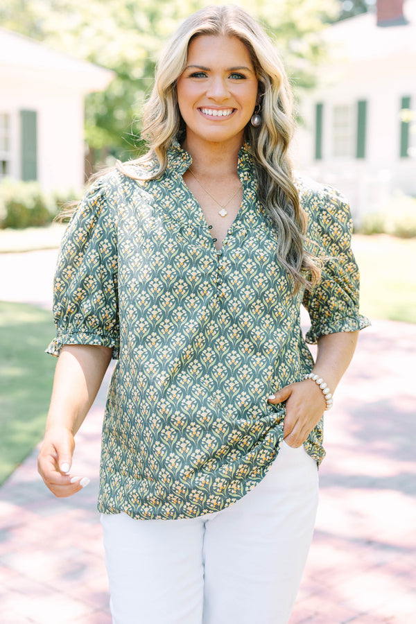 Plus Size green floral print top with puff sleeves, a ruffled collar, and a button-down neckline.