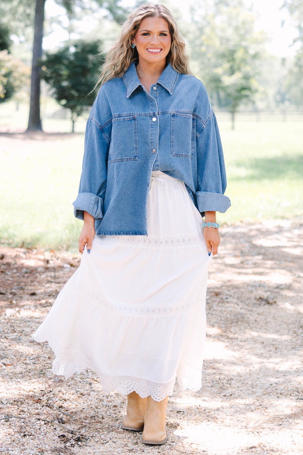 Plus size denim jacket with a relaxed fit, button-down front, and chest pockets.