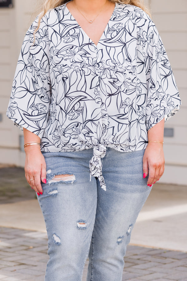 Chic Soul plus size clothing, short-sleeve off-white top with v-neckline and tie by waistline with black floral pattern 