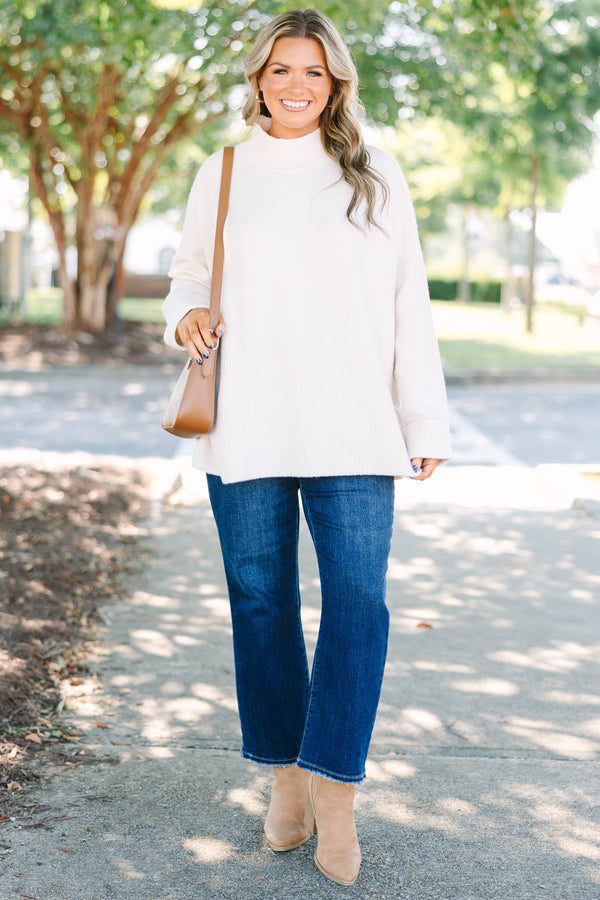 Plus size beige oversized mock neck sweater with a cozy, relaxed fit and ribbed texture.