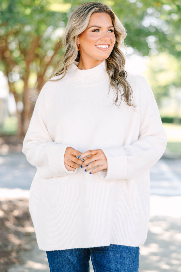 Plus size beige oversized mock neck sweater with a cozy, relaxed fit and ribbed texture.