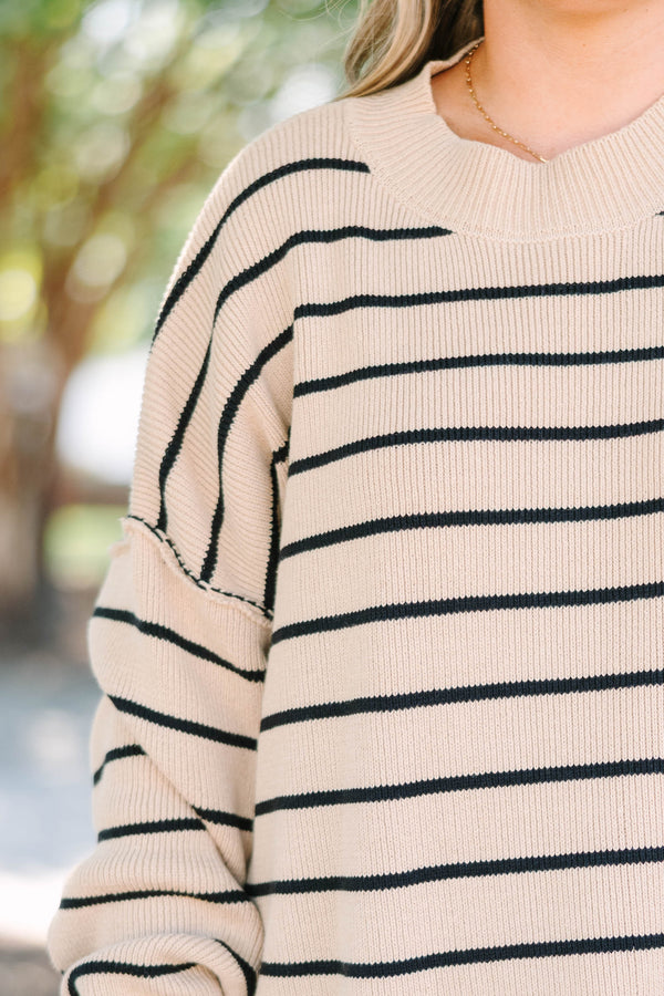 Plus size khaki and black striped knit sweater with a relaxed fit and ribbed crew neckline.