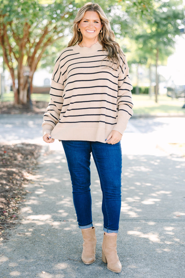 Plus size khaki and black striped knit sweater with a relaxed fit and ribbed crew neckline.