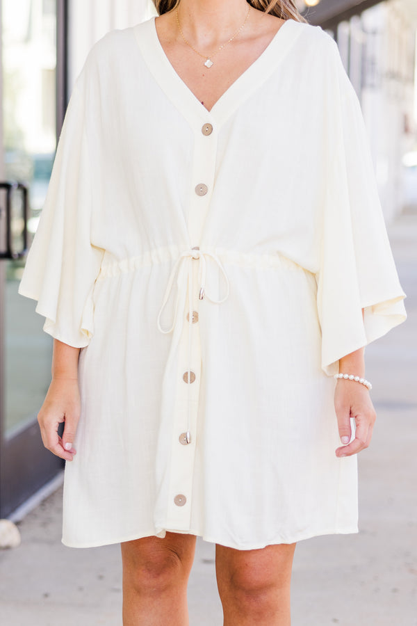 Plus Size ivory linen-blend babydoll dress with a V-neckline, button-down front, and tie waist.
