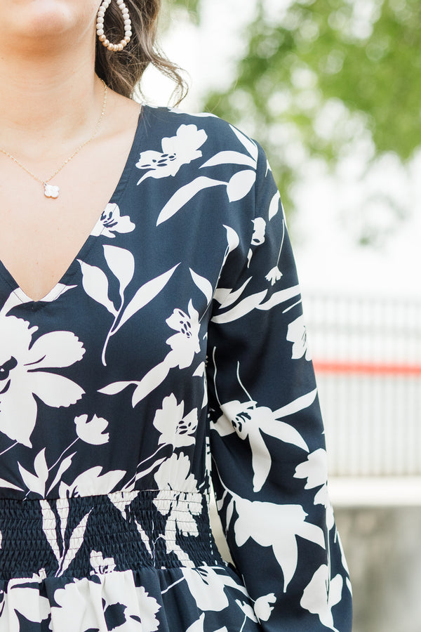 Chic Soul plus size clothing, black long sleeve midi dress with white floral print with cuff sleeves with v neckline and smocked synched waist