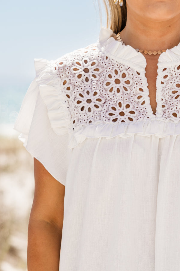 Plus Size off white top with floral lace contrast, flutter sleeves, and a ruffled neckline.