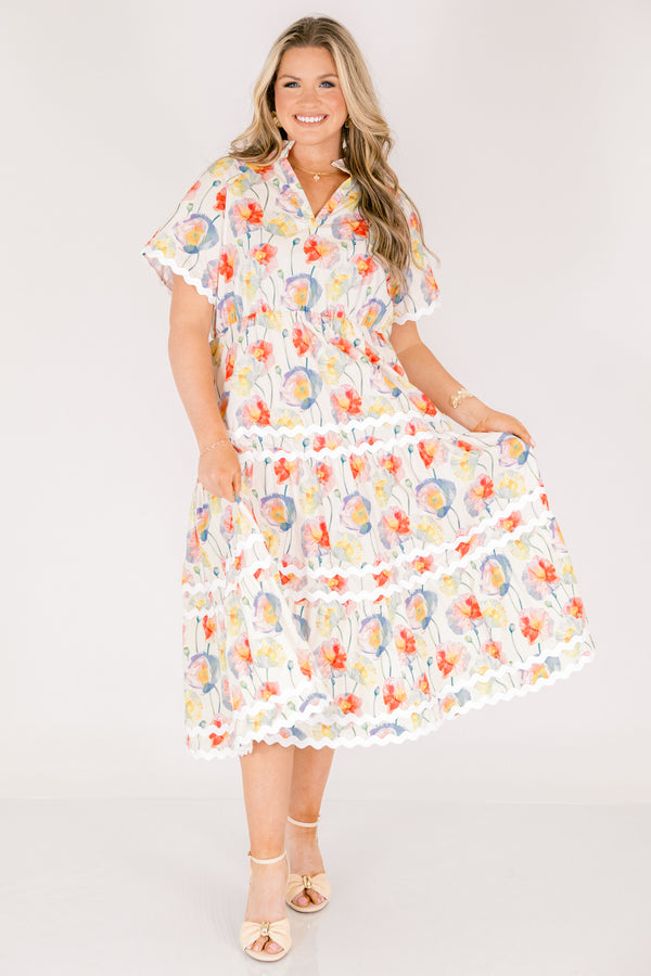 Chic Soul plus size clothing, cream tiered maxi dress with short sleeves and white scalloped details on each tier and at the bottom of the sleeves as well a a multi-color floral abstract pattern and a v-neckline 