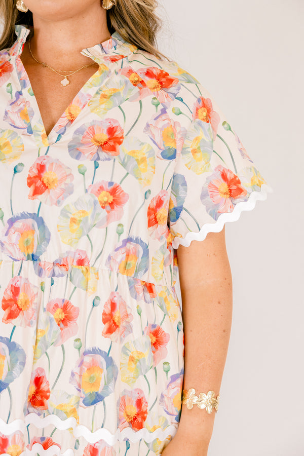 Chic Soul plus size clothing, cream tiered maxi dress with short sleeves and white scalloped details on each tier and at the bottom of the sleeves as well a a multi-color floral abstract pattern and a v-neckline 