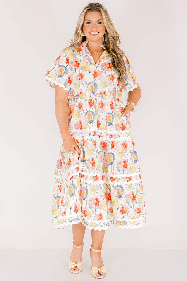 Chic Soul plus size clothing, cream tiered maxi dress with short sleeves and white scalloped details on each tier and at the bottom of the sleeves as well a a multi-color floral abstract pattern and a v-neckline 