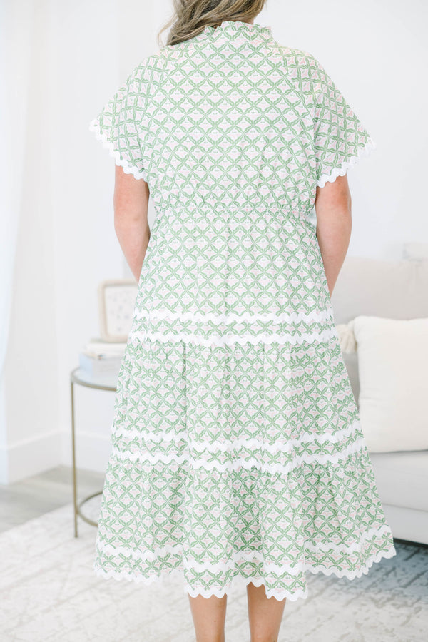 Plus size green and white patterned Maxi Dress with a flowy tiered skirt.