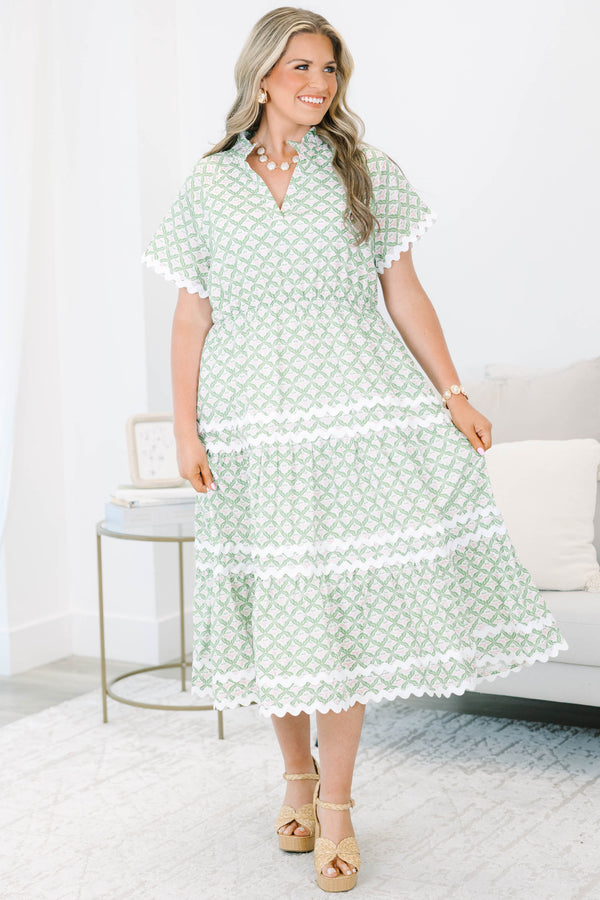 Plus size green and white patterned Maxi Dress with a flowy tiered skirt.