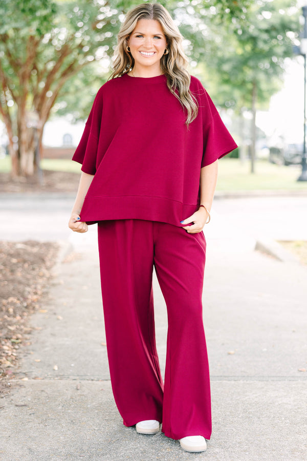 Plus Size red two-piece set with a ribbed short-sleeve crewneck top and matching wide-leg pants.