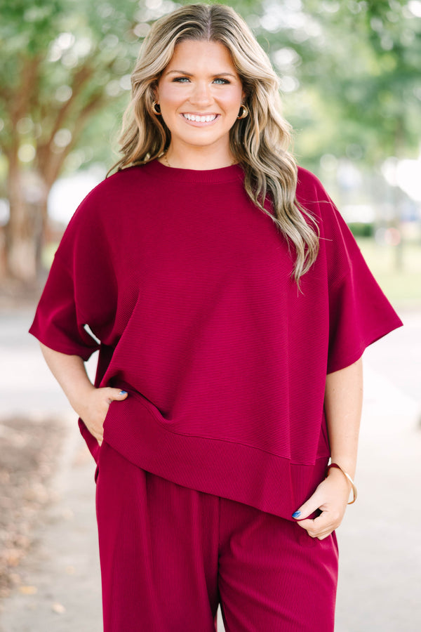 Plus Size red two-piece set with a ribbed short-sleeve crewneck top and matching wide-leg pants.