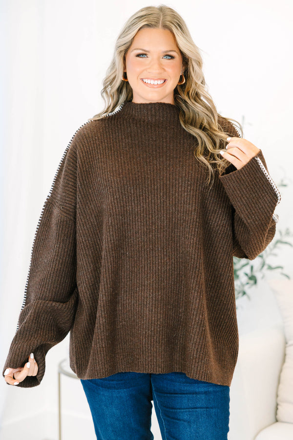 Plus Size brown ribbed knit sweater with a high neckline and white whipstitch trim on the sleeves.