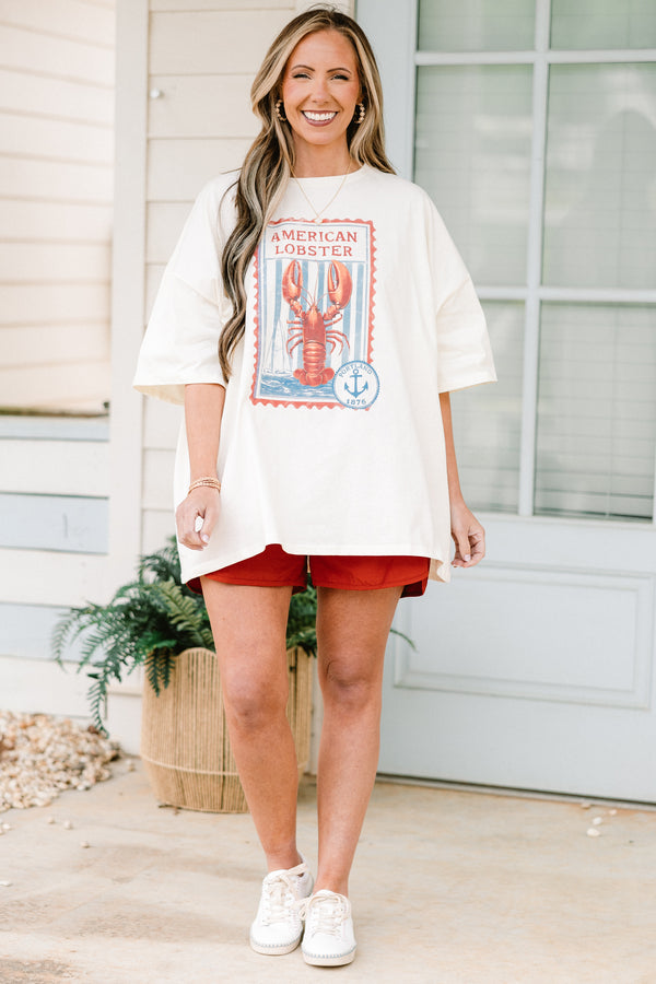 Plus Size copper windbreaker shorts with a smocked waistband and side slit hem.
