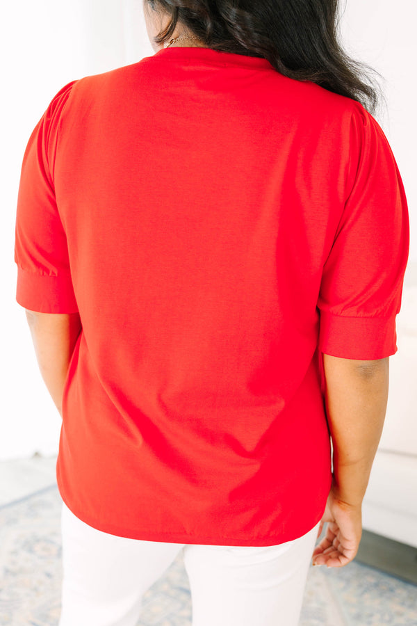 Plus size red short sleeve top with a relaxed fit