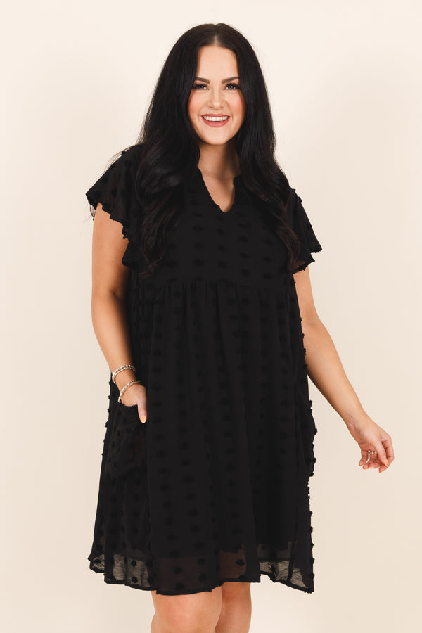 Chic Soul plus size clothing, black flowy dress with an french raised dot pattern , v neckline, and ruffle sleeves