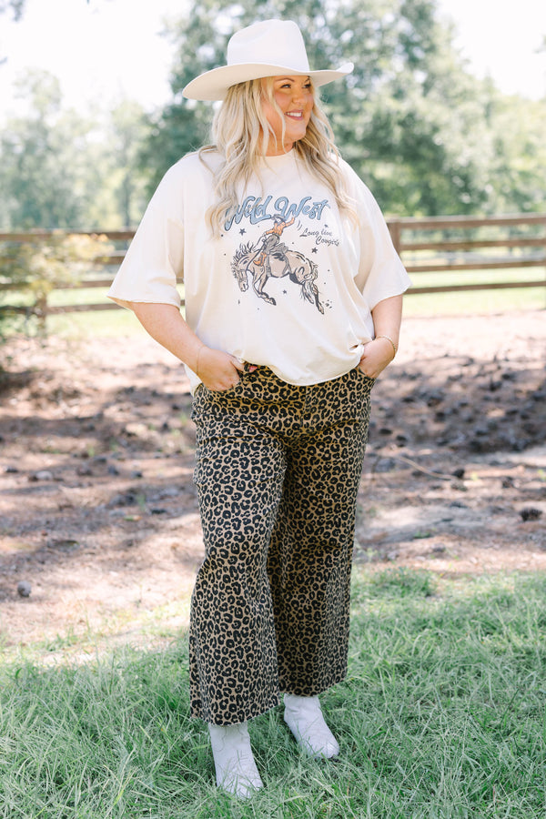 Plus Size wide leg jeans in a dark leopard print denim with a raw hem.