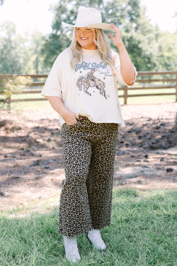 Plus Size wide leg jeans in a dark leopard print denim with a raw hem.