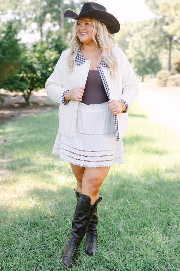 Plus Size cream cotton jacket with a gingham collar and cuffs over a matching white eyelet skirt.