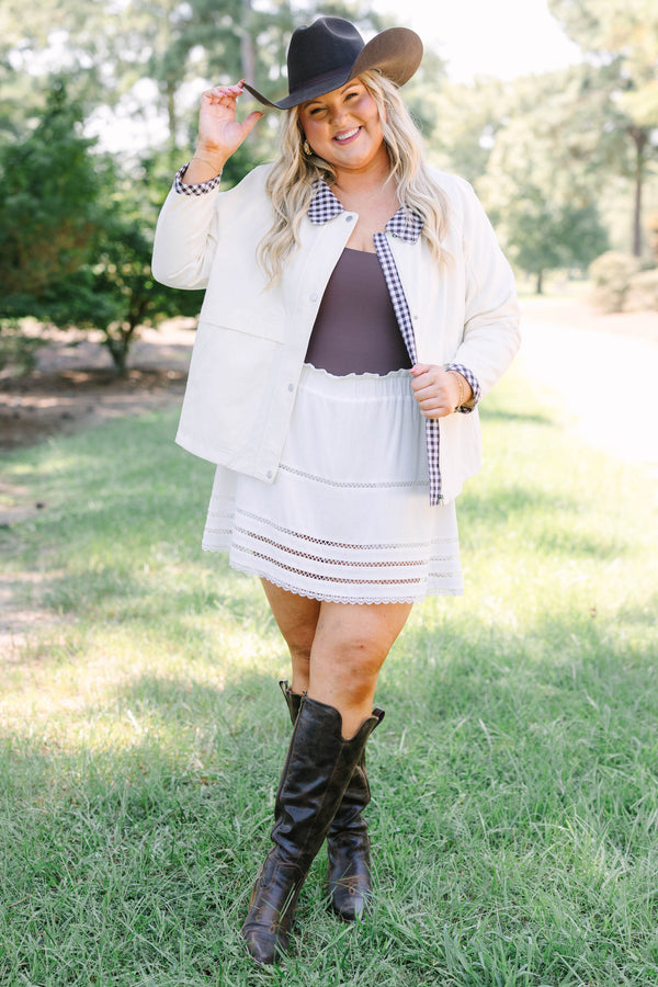 Plus Size cream cotton jacket with a gingham collar and cuffs over a matching white eyelet skirt.