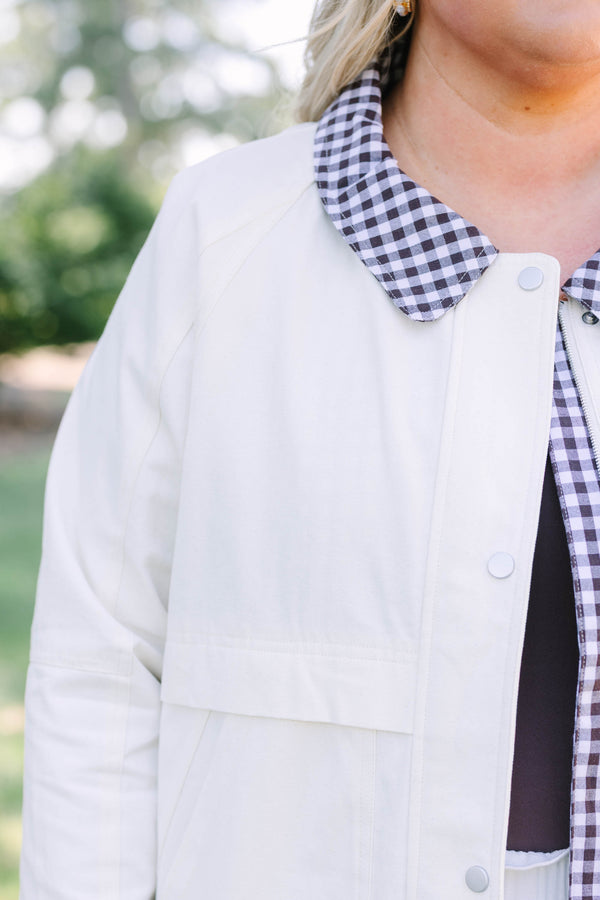 Plus Size cream cotton jacket with a gingham collar and cuffs over a matching white eyelet skirt.