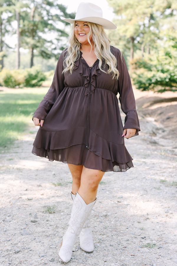 Plus Size brown long sleeve dress with a ruffled V-neckline, tiered skirt, and bell sleeves.
