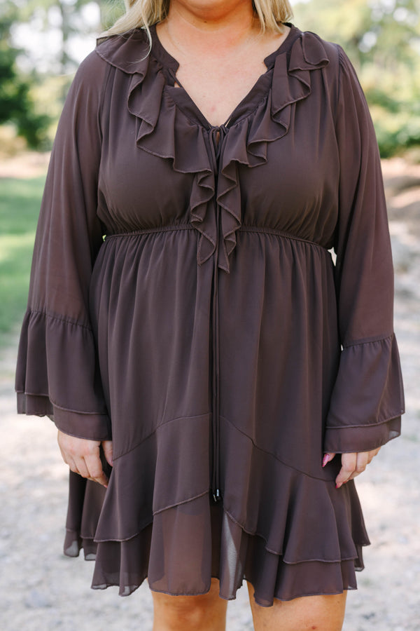 Plus Size brown long sleeve dress with a ruffled V-neckline, tiered skirt, and bell sleeves.