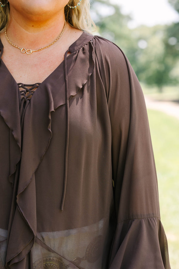 Plus Size brown long sleeve top with ruffle trim, lace-up neckline, and tiered bell sleeves.