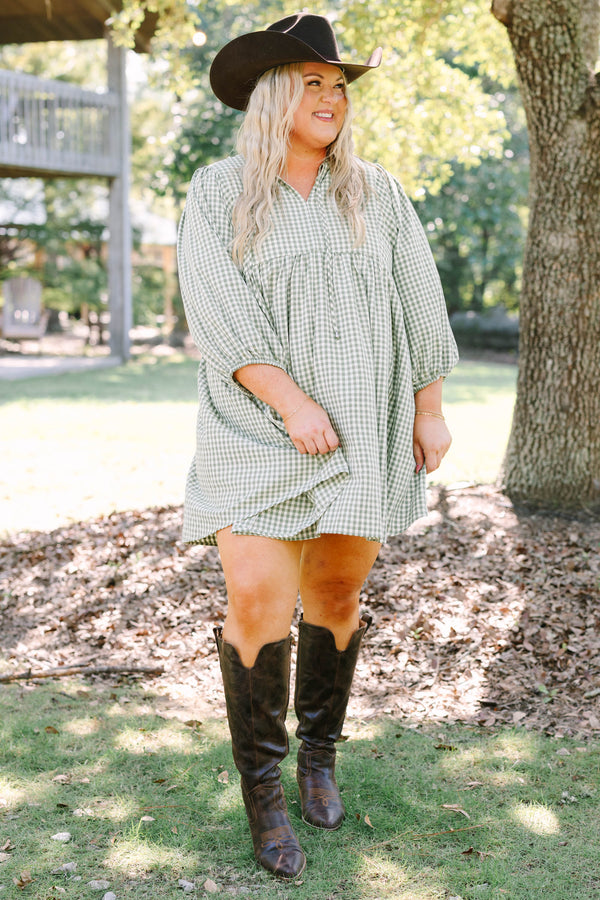 Plus Size green and white gingham babydoll dress with a v-neckline and three-quarter length sleeves.