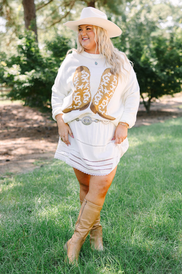 Plus Size ivory knit sweater featuring a crew neckline and a tan western boot graphic on the front.