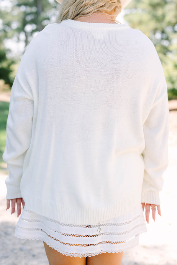 Plus Size ivory knit sweater featuring a crew neckline and a tan western boot graphic on the front.