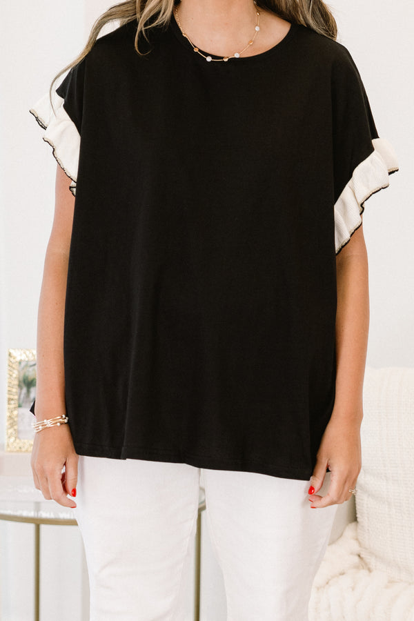 Chic Soul Plus size clothing, black casual top with white flutter sleeves and black stitching detail at the end of each sleeve 
