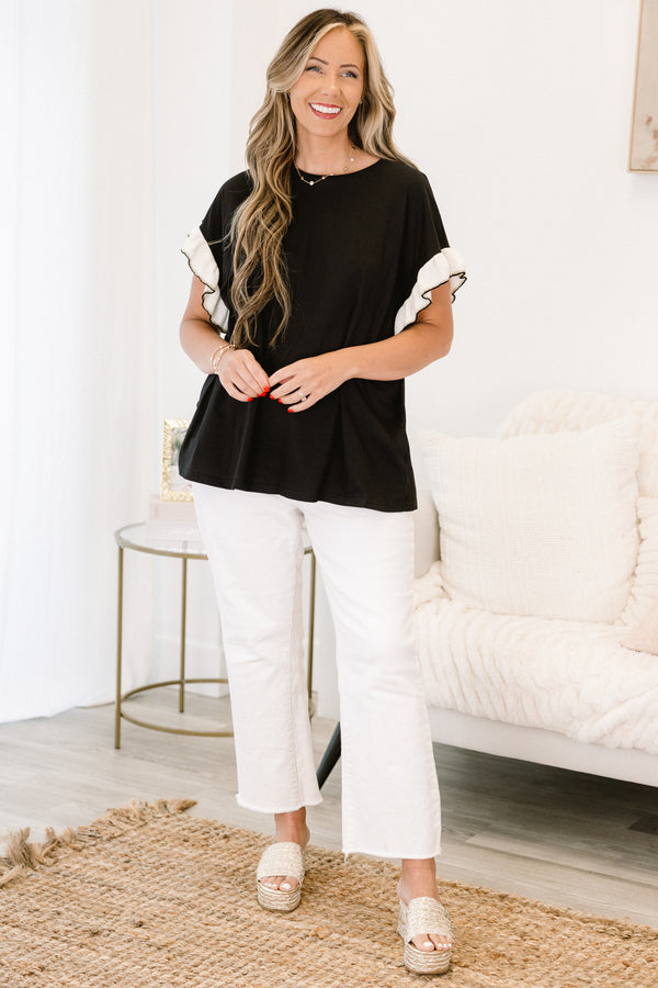 Chic Soul Plus size clothing, black casual top with white flutter sleeves and black stitching detail at the end of each sleeve 
