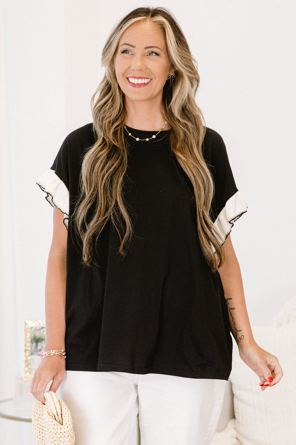 Chic Soul Plus size clothing, black casual top with white flutter sleeves and black stitching detail at the end of each sleeve 
