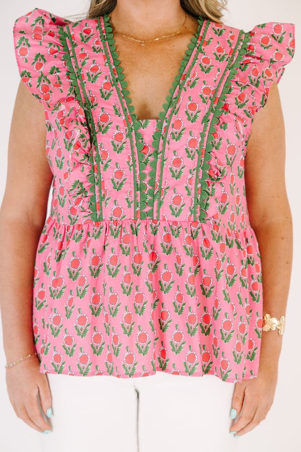 Chic Soul plus size clothing, pink top with flutter sleeves and a pink and green floral pattern as well as green scalloped detailing going along the v-neckline and the sides of the neckline 