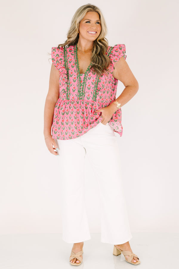 Chic Soul plus size clothing, pink top with flutter sleeves and a pink and green floral pattern as well as green scalloped detailing going along the v-neckline and the sides of the neckline 