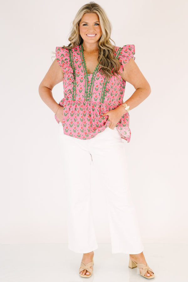 Chic Soul plus size clothing, pink top with flutter sleeves and a pink and green floral pattern as well as green scalloped detailing going along the v-neckline and the sides of the neckline 
