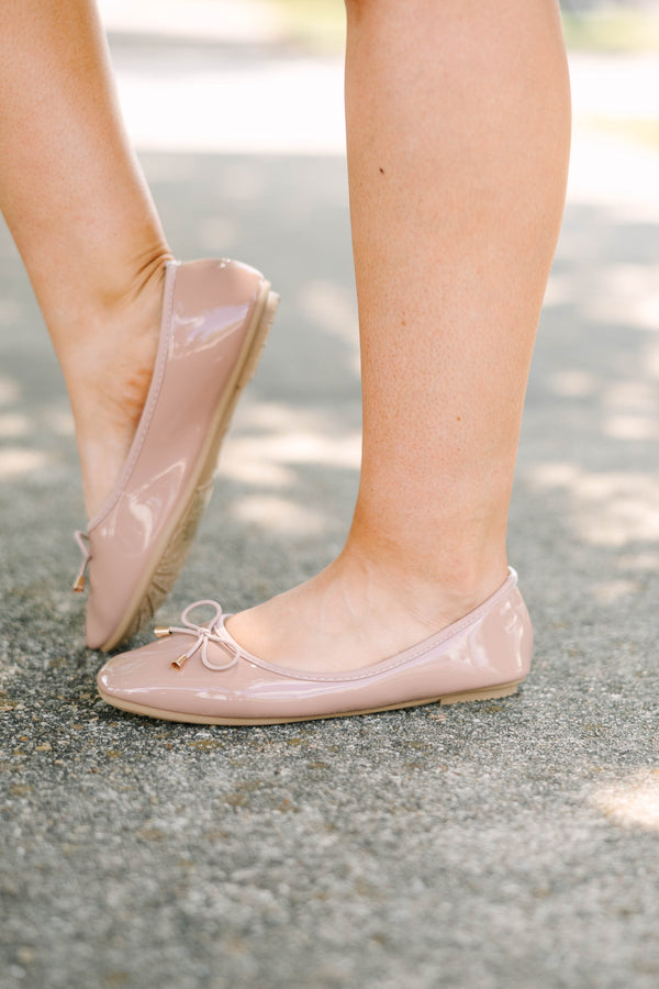 Plus Size blush patent leather ballet flats with a round toe and a delicate bow detail.
